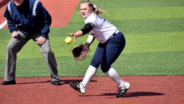 365英国上市杜波依斯分校 senior Paige Pleta makes a short throw to first base during a recent softball game