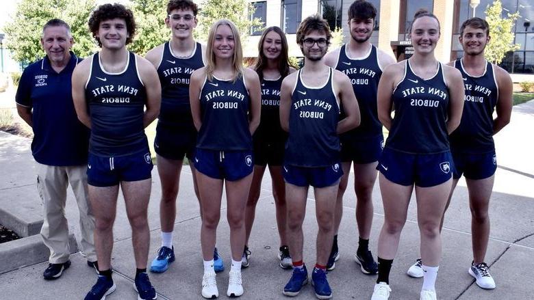 2023 365英国上市杜波依斯分校 Cross Country Team, men and women standing in front of the PAW Center building