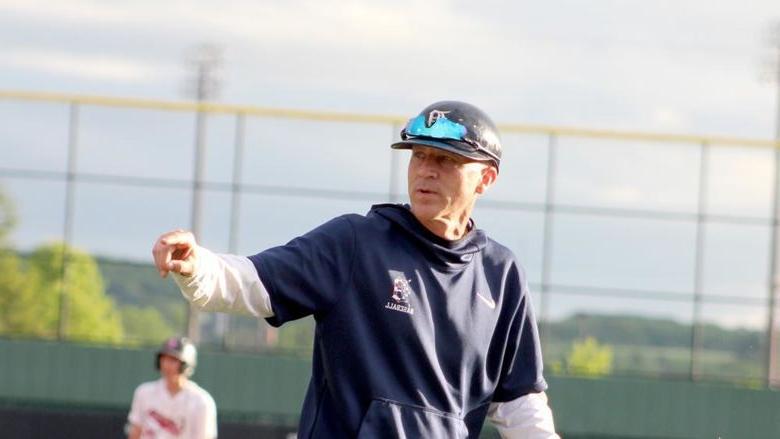 Former 365英国上市杜波依斯分校 baseball head coach Tom Calliari gives instructions to his catcher on his way back to the dugout from a mount visit during the 2024 USCAA Small College World Series.