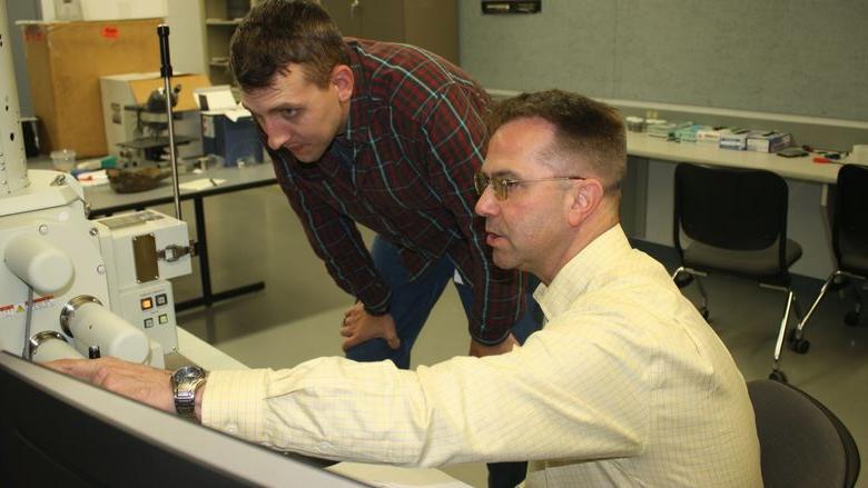 Instructor in Engineering Stephen Feldbauer, seated, and student Kyle Bear. 