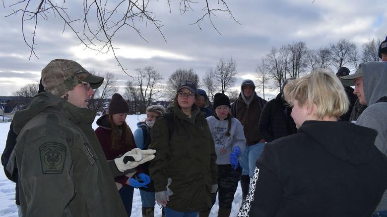 Pennsylvania State Game Warden Thomas Henry led students in a simulated investigation of the illegal killing of a deer.  