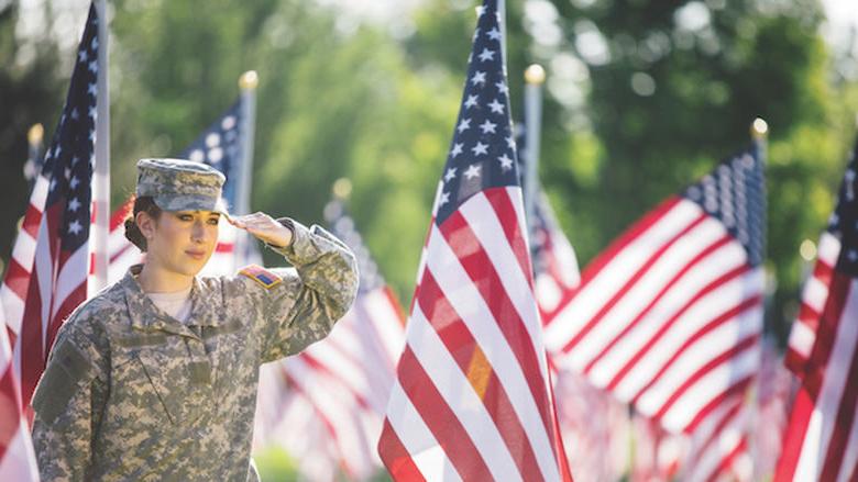 Female Army veteran and flags